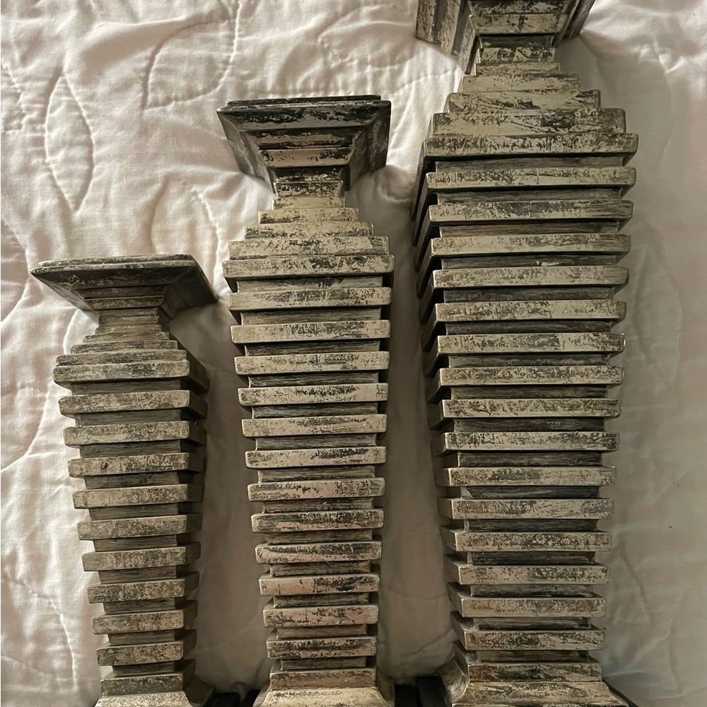 3 Candle Holders with a Rustic Distressed look. Very pretty with candles lit.